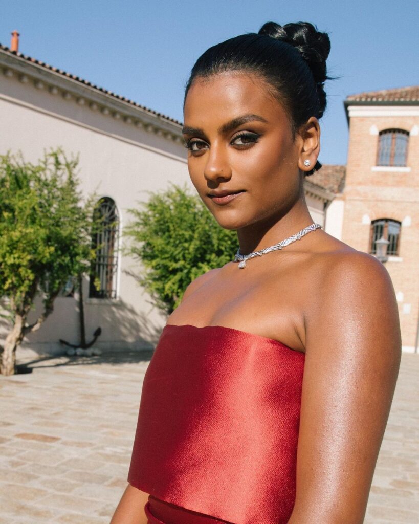 Simone Ashley's stylish red outfit.